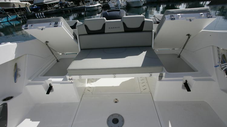 Standard drainable wells under stern seats and dedicated space for Igloo coolbox